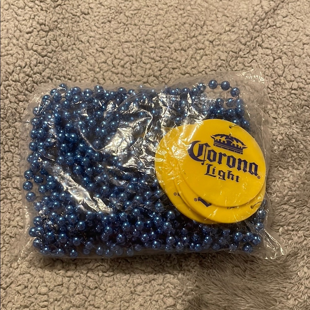 12 Corona Light Yellow Coasters with Blue Beads necklace